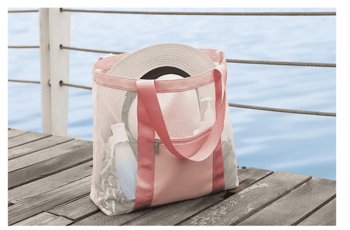 pink tote bag on beach